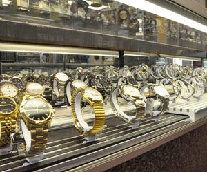 Norman-Hege-Jewelers-display-case-of-watches Norman Hege Jewelers | Glass display case showcasing a various selection of fine watches in gold and silver